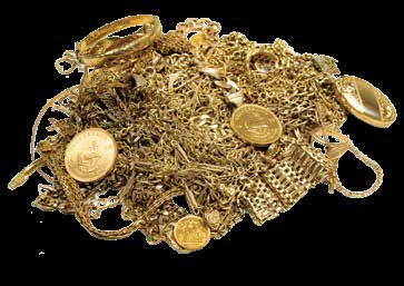 A pile of scrap gold chains, rings and sovereign coins
