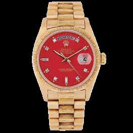 Gold Rolex Day-Date wristwatch with a red dial